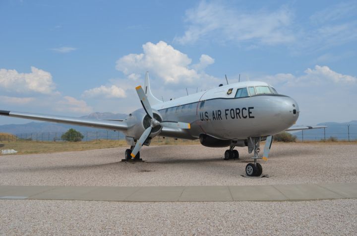 Flight Training - white and blue airplane on gray concrete ground under blue and white cloudy sky during daytime