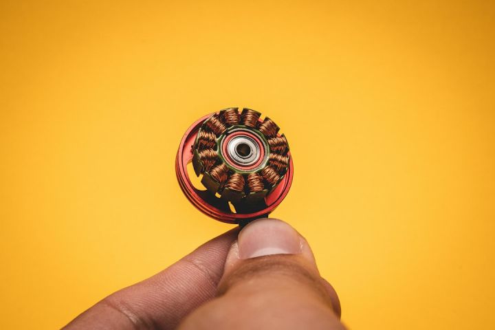 Fpv - person holding red and yellow round ornament