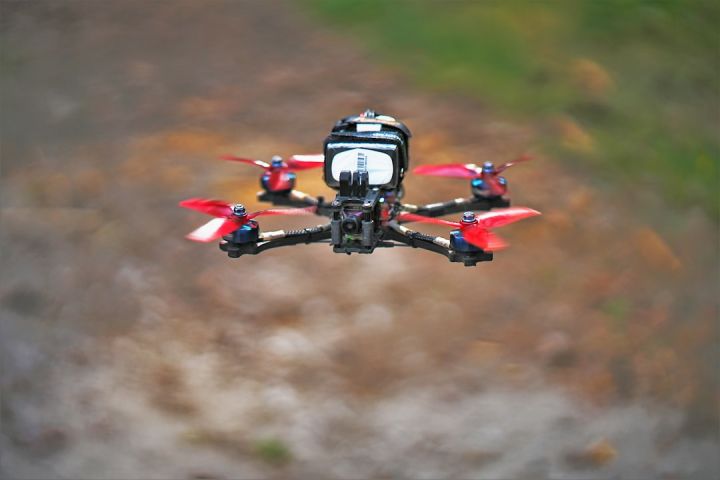 Fpv - a red and black remote controlled flying device