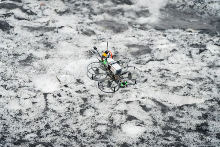 Fpv - an aerial view of a remote controlled device in the snow