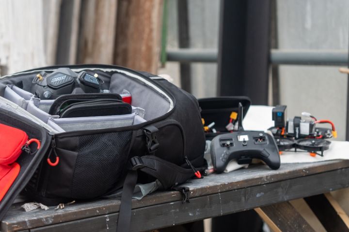 Fpv - a back pack sitting on top of a wooden table