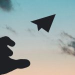 Flying - Silhouette Photo of Man Throw Paper Plane