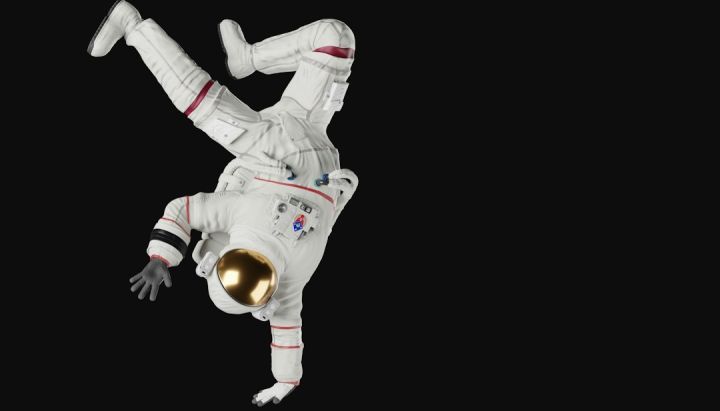 Model Rocket - a person in a white space suit doing a handstand