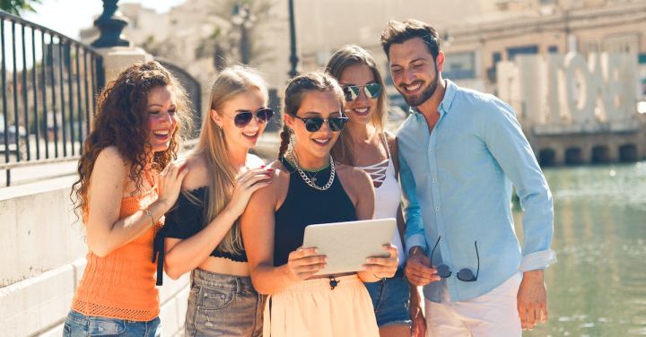 Share - Group of People Standing Beside Body of Water